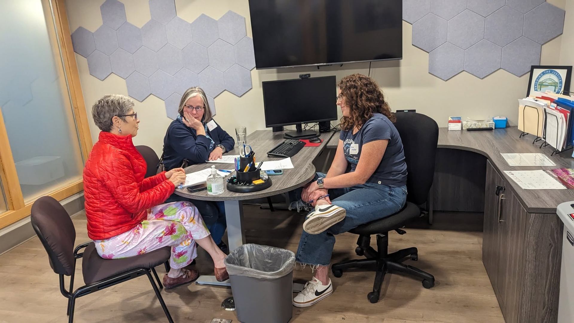A small-group consulting session around a table